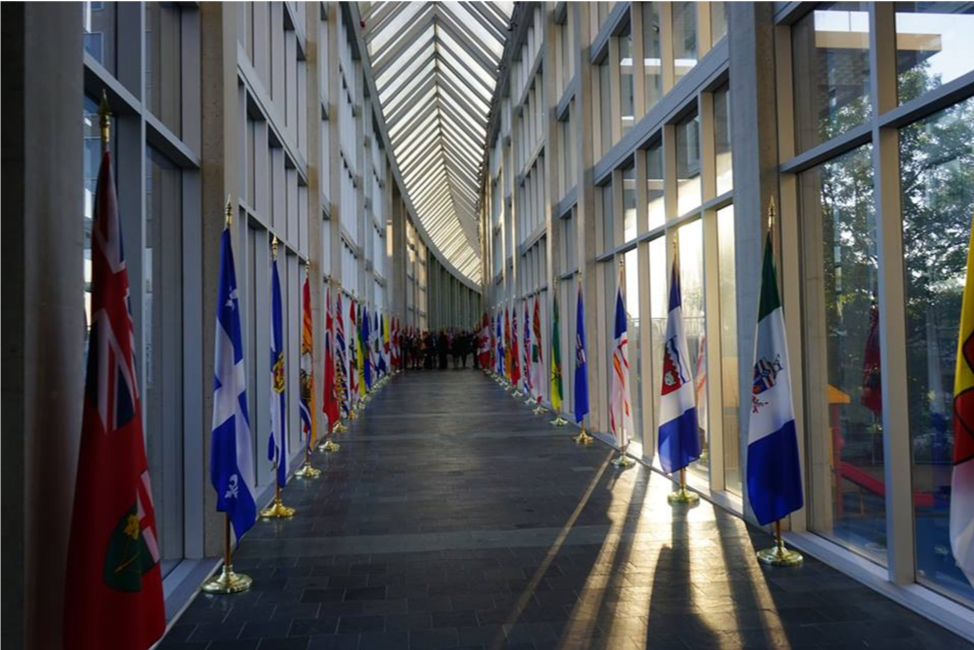 Diefenbaker Building 25 - interior view of western walkway looking south with flags