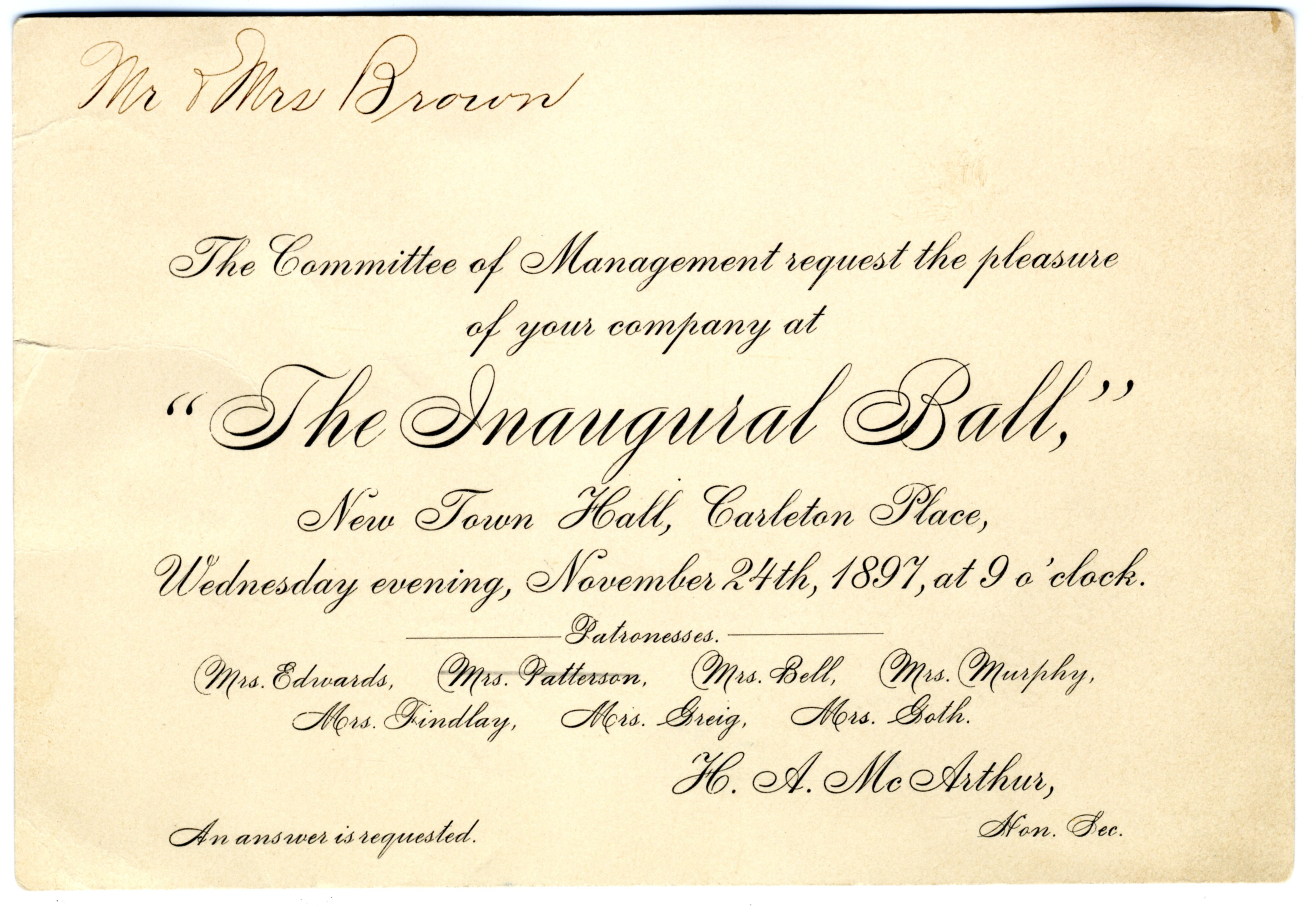 Rectangular card with black text that reads "Mr and Mrs Brown, The Committee of Management request the pleasure of your company at "The Inaugural Ball", New Town Hall, Carleton Place, Wednesday evening, November 24th, 1897 at 9'oclock" signed H.A McArthur 