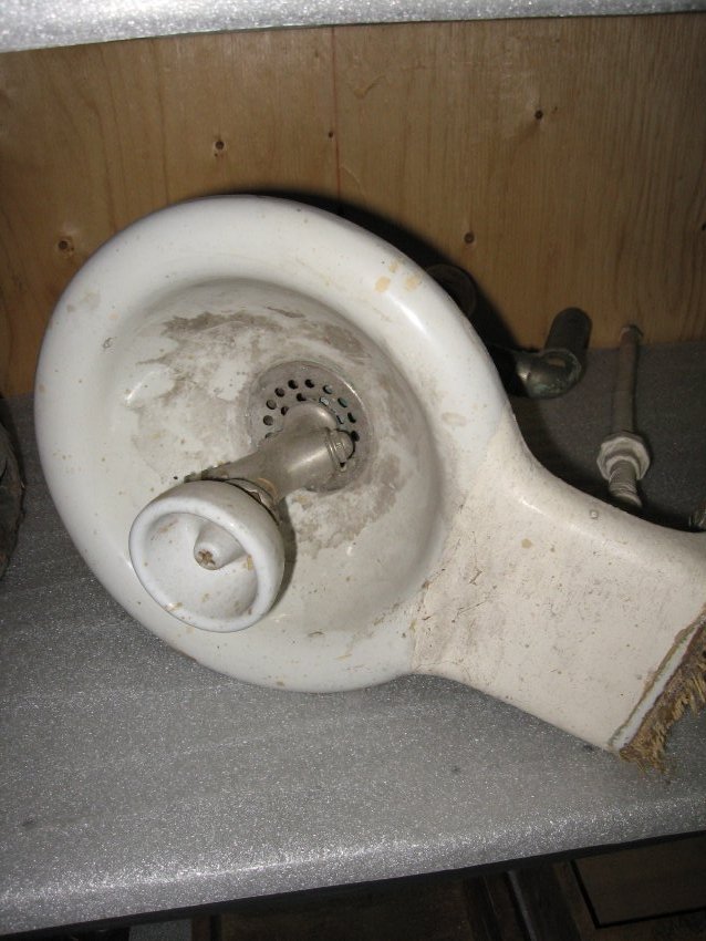 A white porcelain drinking fountain.