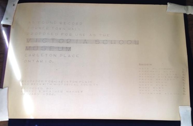 The floor plans and elevation of Carleton Place's former Town Hall, Victoria School, and the current Carleton Place and Beckwith Heritage Museum. The plan is 10 pages long including the cover, and is drawn in blue/ black ink on thick, white paper. The pages are held together by staples.