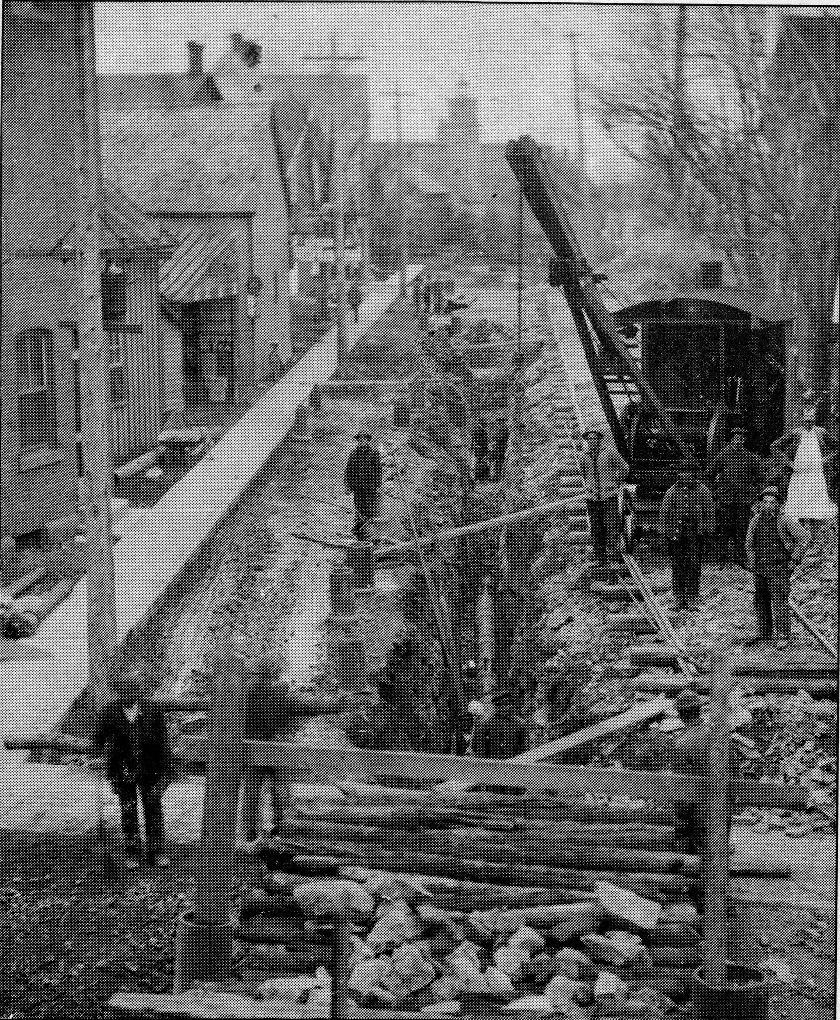 An image of workers installing Waterworks infrastructure under the streets of Carleton Place. 